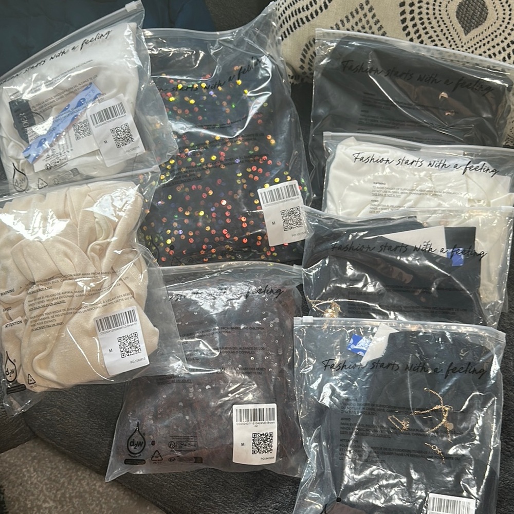 Assorted Cider dresses and tops. Sequin and neutral tones.